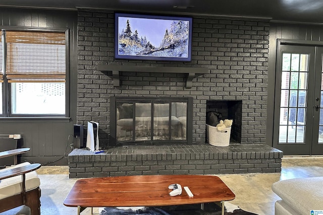 living area featuring a healthy amount of sunlight and a fireplace