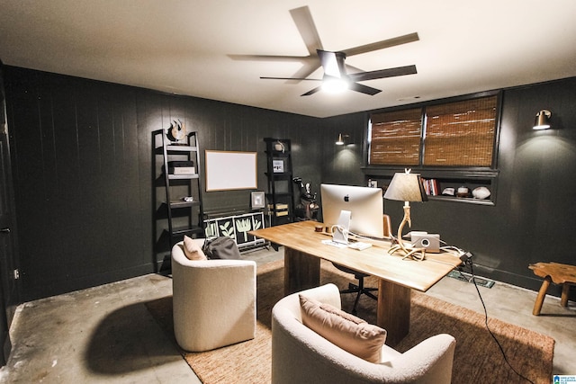 office with concrete flooring and a ceiling fan