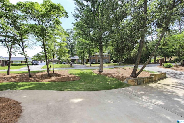 surrounding community featuring a lawn