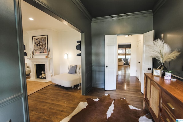 corridor featuring crown molding and wood finished floors