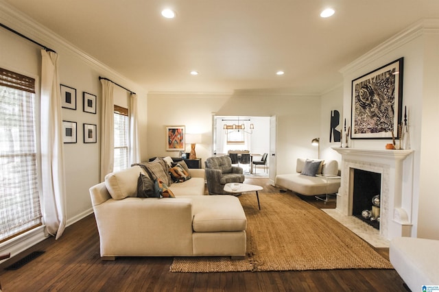living room featuring visible vents, crown molding, a fireplace with flush hearth, dark wood-style floors, and recessed lighting