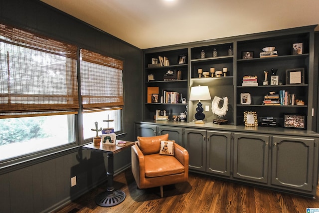 sitting room with dark wood-style flooring