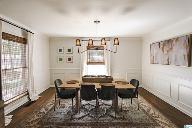 dining area featuring plenty of natural light, dark wood-type flooring, and an inviting chandelier