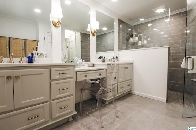 bathroom with a sink, double vanity, tile patterned floors, ornamental molding, and tiled shower
