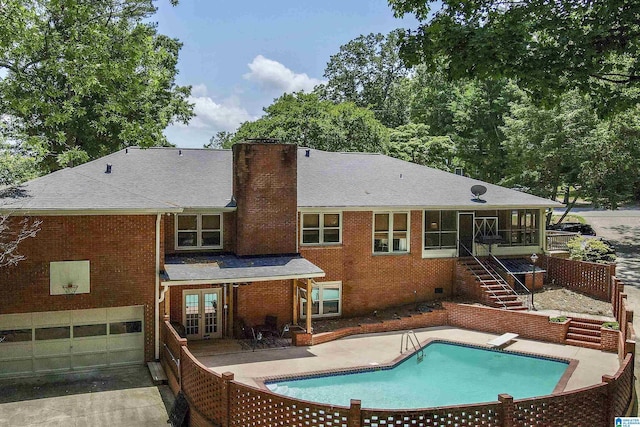 5 Christopher Way, Anniston, AL 36207 - rear view of house with a chimney, french doors, stairway, an outdoor pool, and brick siding