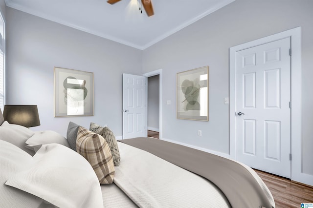 bedroom with baseboards, a ceiling fan, and wood finished floors