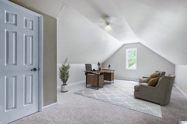 office space with baseboards, ceiling fan, carpet, and lofted ceiling
