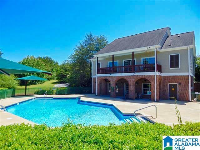 view of pool featuring a patio, fence, and a fenced in pool