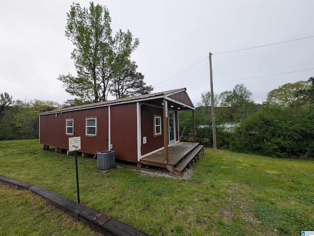 view of outbuilding featuring central AC unit and an outdoor structure