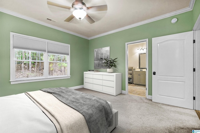 bedroom with visible vents, ornamental molding, baseboards, carpet, and ensuite bath
