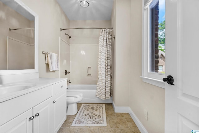 full bath with baseboards, vanity, tile patterned floors, toilet, and shower / bath combo with shower curtain