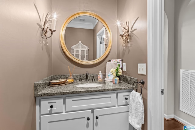 3057 Valley Ridge Rd, Hoover, AL 35242 - bathroom featuring crown molding, visible vents, and vanity