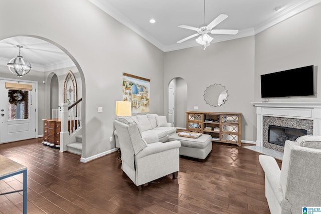 3057 Valley Ridge Rd, Hoover, AL 35242 - living area with arched walkways, a fireplace with flush hearth, wood finished floors, and ornamental molding