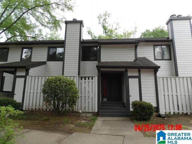 3821 Windhover Cir Unit 6, Vestavia Hills, AL 35216 - view of front of property with fence and a chimney
