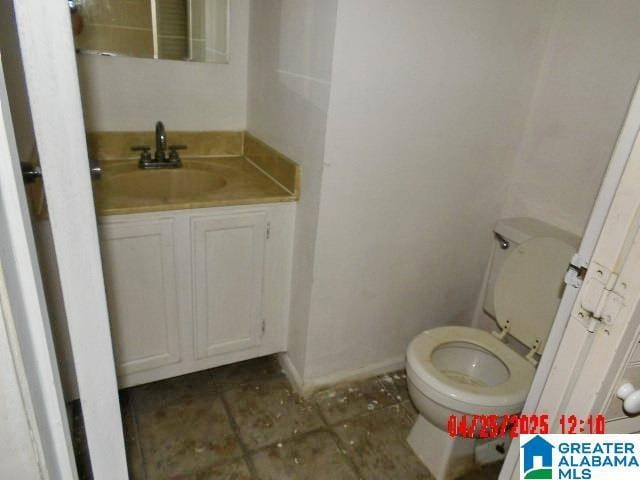 3821 Windhover Cir Unit 6, Vestavia Hills, AL 35216 - bathroom with vanity, tile patterned floors, baseboards, and toilet