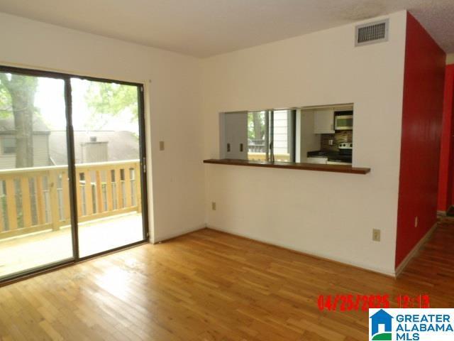 3821 Windhover Cir Unit 6, Vestavia Hills, AL 35216 - spare room featuring visible vents and wood finished floors