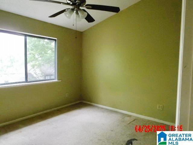 3821 Windhover Cir Unit 6, Vestavia Hills, AL 35216 - carpeted spare room featuring baseboards and ceiling fan