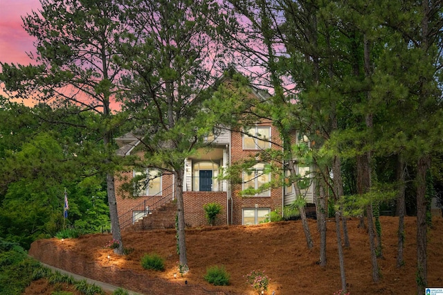 view of property exterior with brick siding