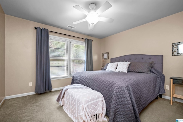 bedroom featuring baseboards, ceiling fan, carpet flooring, and visible vents
