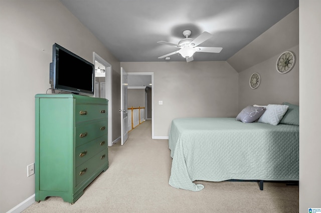bedroom with a ceiling fan, baseboards, light carpet, and lofted ceiling