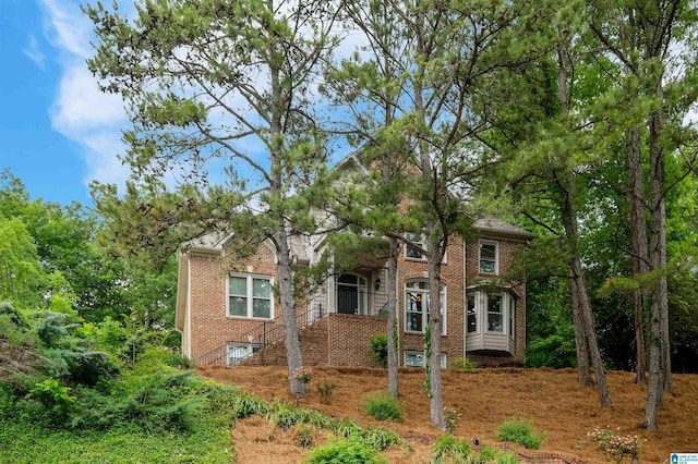 view of front of house featuring brick siding
