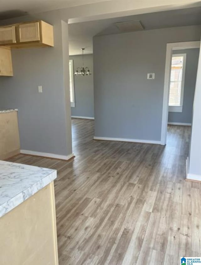 2129 Northland Ave SW, Birmingham, AL 35211 - interior space with baseboards, an inviting chandelier, and light wood-type flooring