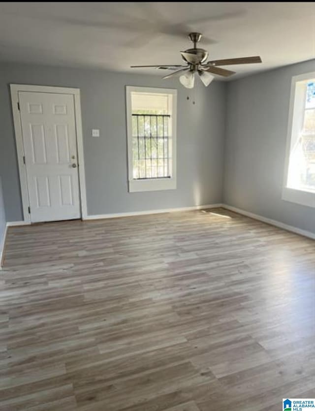 2129 Northland Ave SW, Birmingham, AL 35211 - empty room featuring baseboards, a ceiling fan, and wood finished floors