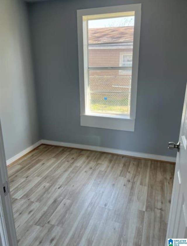 2129 Northland Ave SW, Birmingham, AL 35211 - unfurnished room with baseboards and wood finished floors