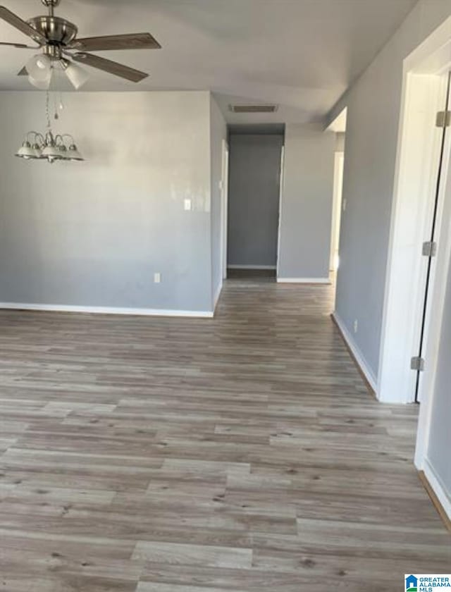 2129 Northland Ave SW, Birmingham, AL 35211 - spare room with baseboards, ceiling fan, wood finished floors, and visible vents