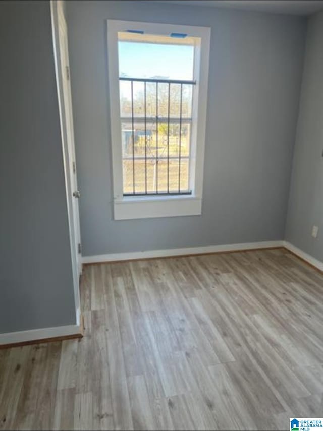 2129 Northland Ave SW, Birmingham, AL 35211 - spare room featuring baseboards and wood finished floors