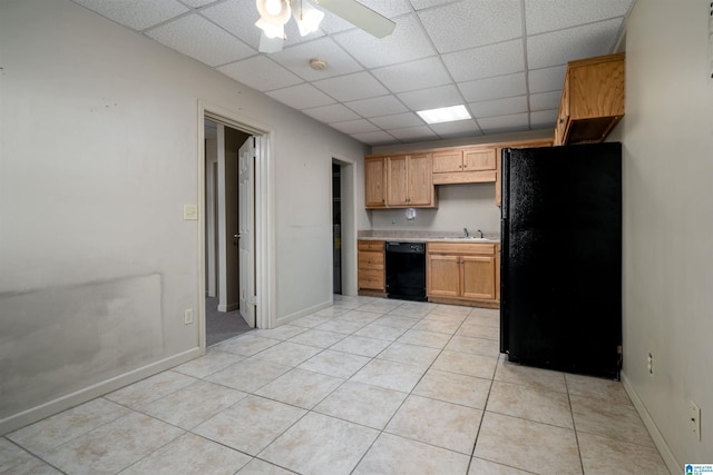 1212 12th St Unit 17, Tuscaloosa, AL 35401 - kitchen with black appliances, a paneled ceiling, light tile patterned floors, light countertops, and a sink