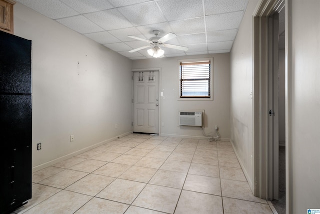 1212 12th St Unit 17, Tuscaloosa, AL 35401 - foyer with a paneled ceiling, ceiling fan, a wall mounted air conditioner, light tile patterned flooring, and baseboards