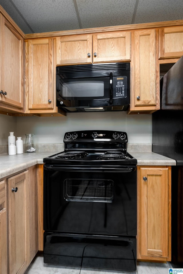 1212 12th St Unit 17, Tuscaloosa, AL 35401 - kitchen featuring black appliances and light countertops