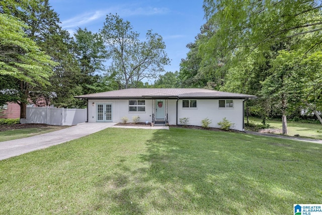 3824 Midway Rd, Adamsville, AL 35005 - ranch-style home featuring driveway, french doors, metal roof, a front yard, and fence