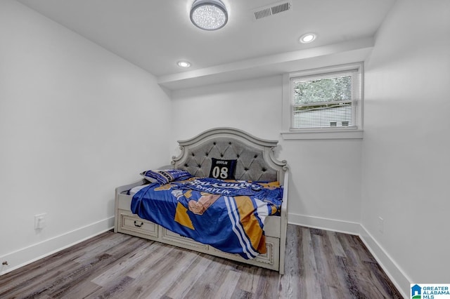 3824 Midway Rd, Adamsville, AL 35005 - bedroom with baseboards, recessed lighting, wood finished floors, and visible vents