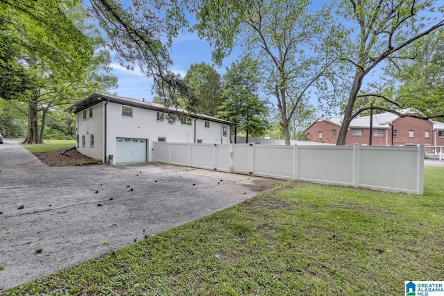 3824 Midway Rd, Adamsville, AL 35005 - exterior space with an attached garage, a gate, fence, and a yard
