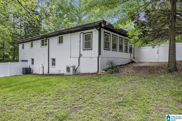 3824 Midway Rd, Adamsville, AL 35005 - view of property exterior featuring a fenced backyard, central AC unit, ac unit, and a yard