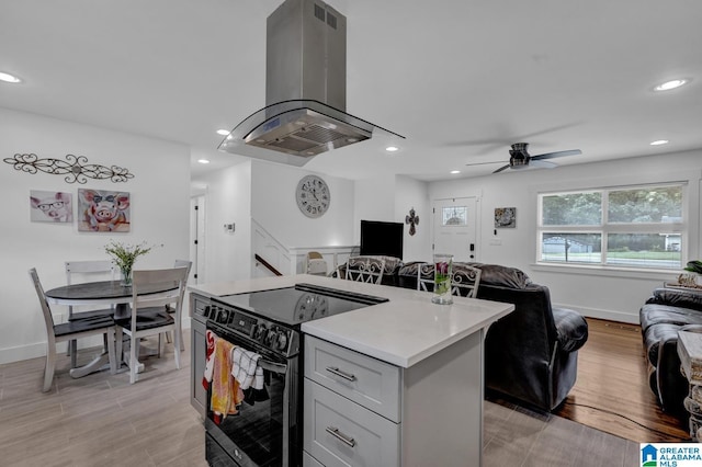 3824 Midway Rd, Adamsville, AL 35005 - kitchen featuring a ceiling fan, island exhaust hood, black electric range, light countertops, and open floor plan