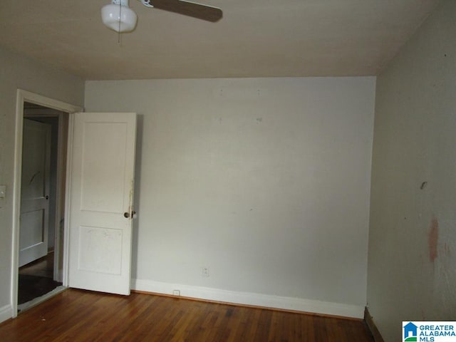 unfurnished bedroom with baseboards, a ceiling fan, and wood finished floors