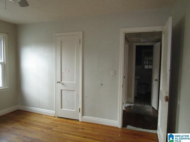 unfurnished bedroom featuring baseboards and light wood-style floors