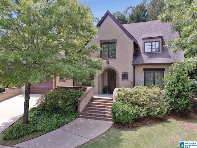 364 Stone Brook Cir, Hoover, AL 35226 - tudor house featuring roof with shingles and brick siding
