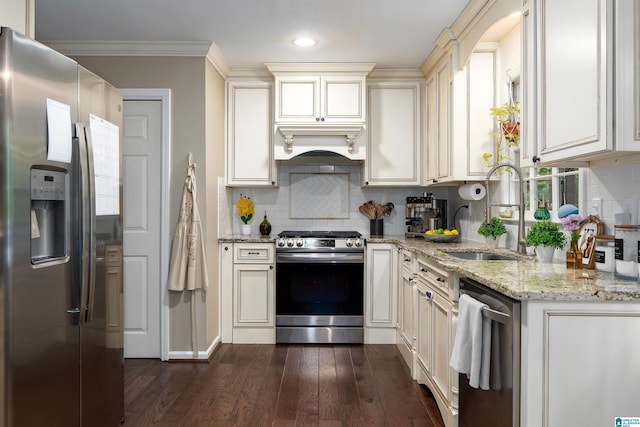 2017 Crossvine Rd, Hoover, AL 35244 - kitchen featuring dark wood-style flooring, appliances with stainless steel finishes, light stone counters, a sink, and decorative backsplash