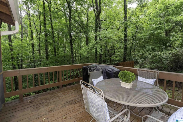2017 Crossvine Rd, Hoover, AL 35244 - wooden deck featuring a view of trees and outdoor dining space