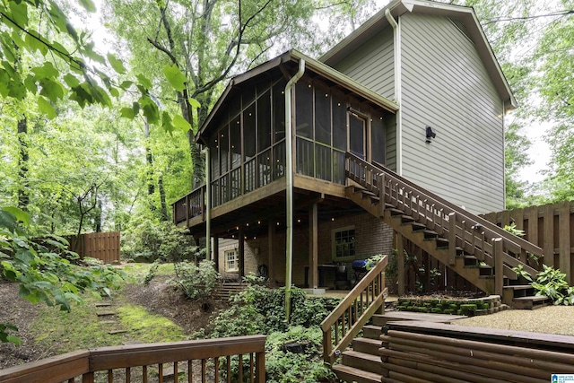 2017 Crossvine Rd, Hoover, AL 35244 - rear view of property featuring stairs, brick siding, fence, and a sunroom