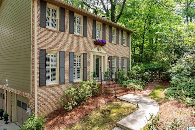 2017 Crossvine Rd, Hoover, AL 35244 - colonial inspired home featuring brick siding and a garage
