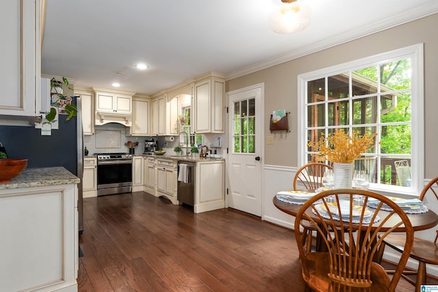 2017 Crossvine Rd, Hoover, AL 35244 - kitchen with ornamental molding, dark wood-type flooring, cream cabinetry, a sink, and stainless steel appliances