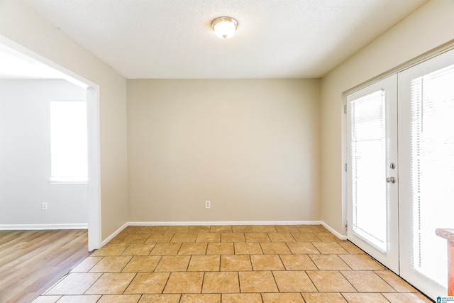 empty room featuring baseboards