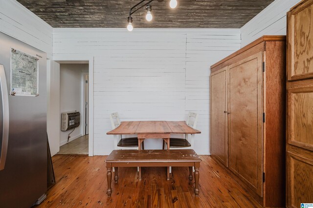 1352 County Road 185, Jemison, AL 35085 - dining space featuring heating unit, wood-type flooring, and wood walls
