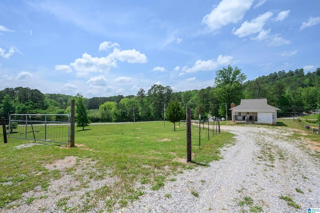 1352 County Road 185, Jemison, AL 35085 - view of yard featuring gravel driveway, a rural view, and a view of trees