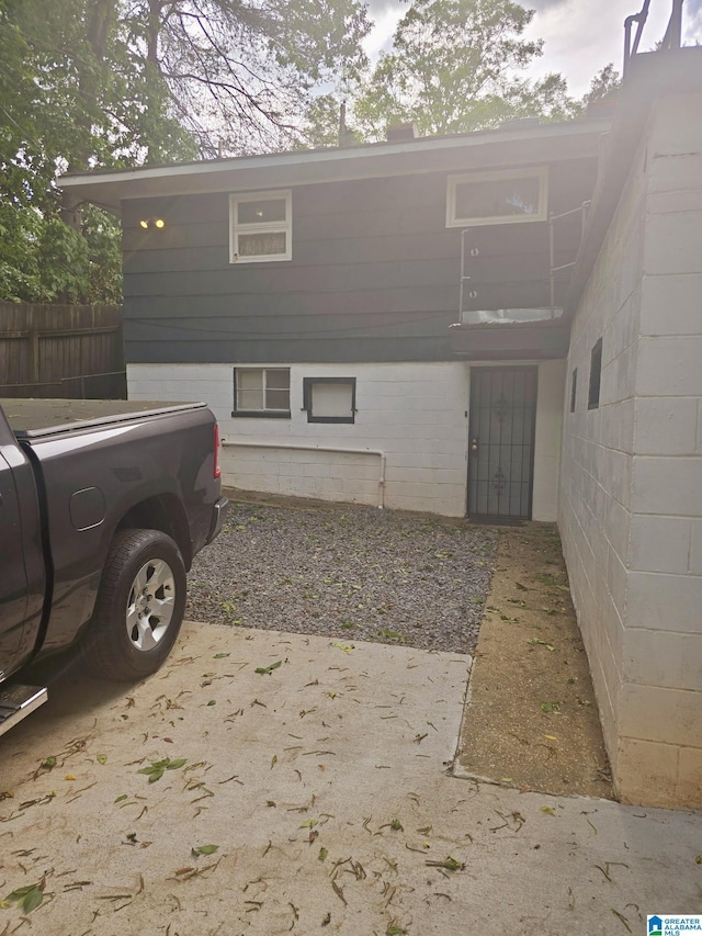 view of home's exterior featuring fence